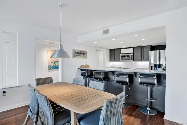 a kitchen with a table and chairs in it