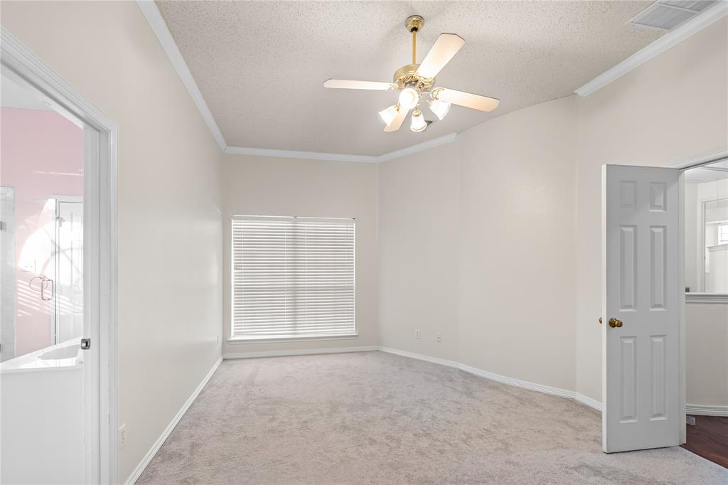 9447 Abbey Road Irving, TX 75063 - Photo 26 of 40 an empty room with windows and fan