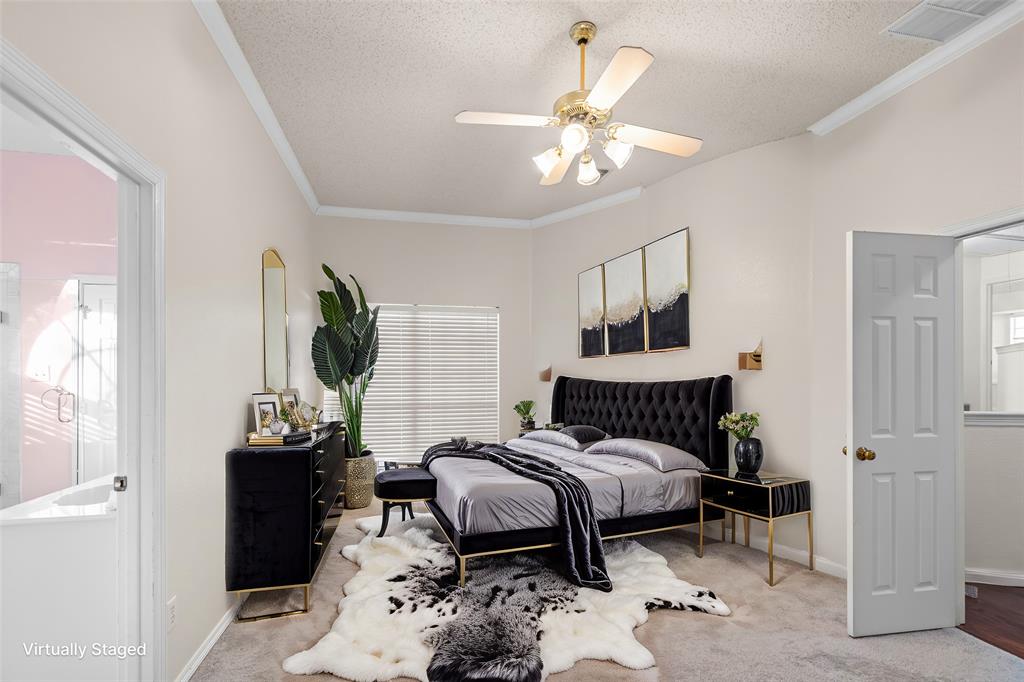 9447 Abbey Road Irving, TX 75063 - Photo 27 of 40 a bedroom with a bed and wooden floor