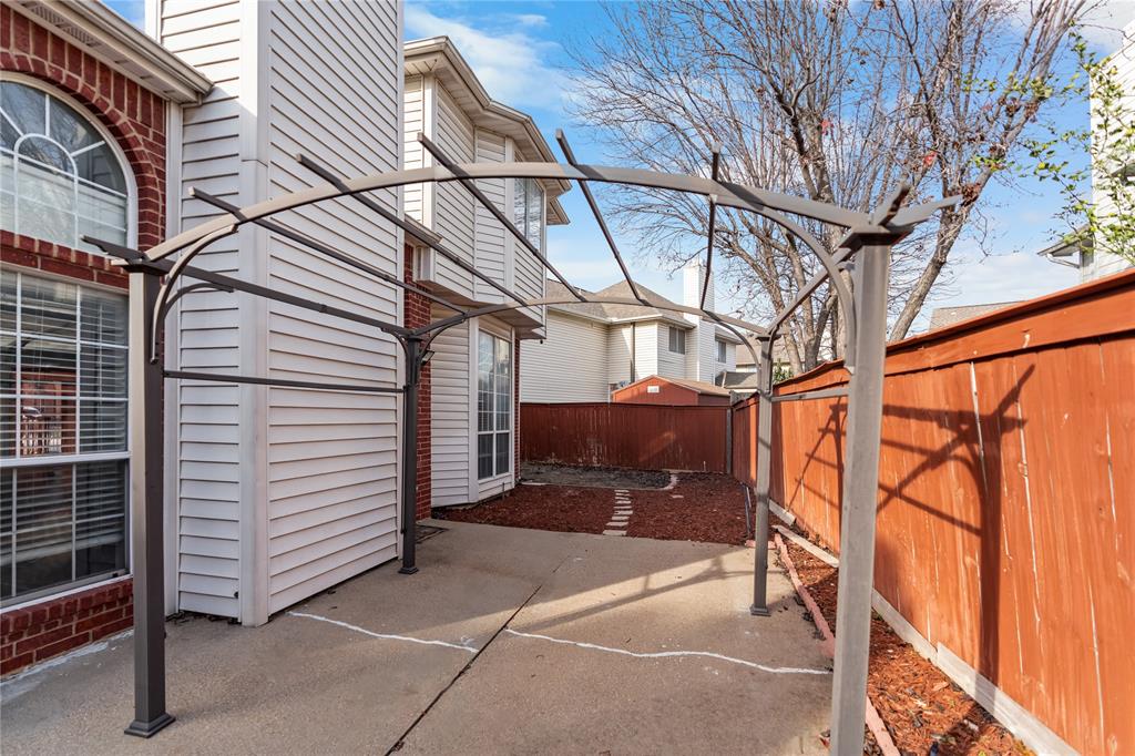 9447 Abbey Road Irving, TX 75063 - Photo 33 of 40 a view of a porch with wooden walls and stairs