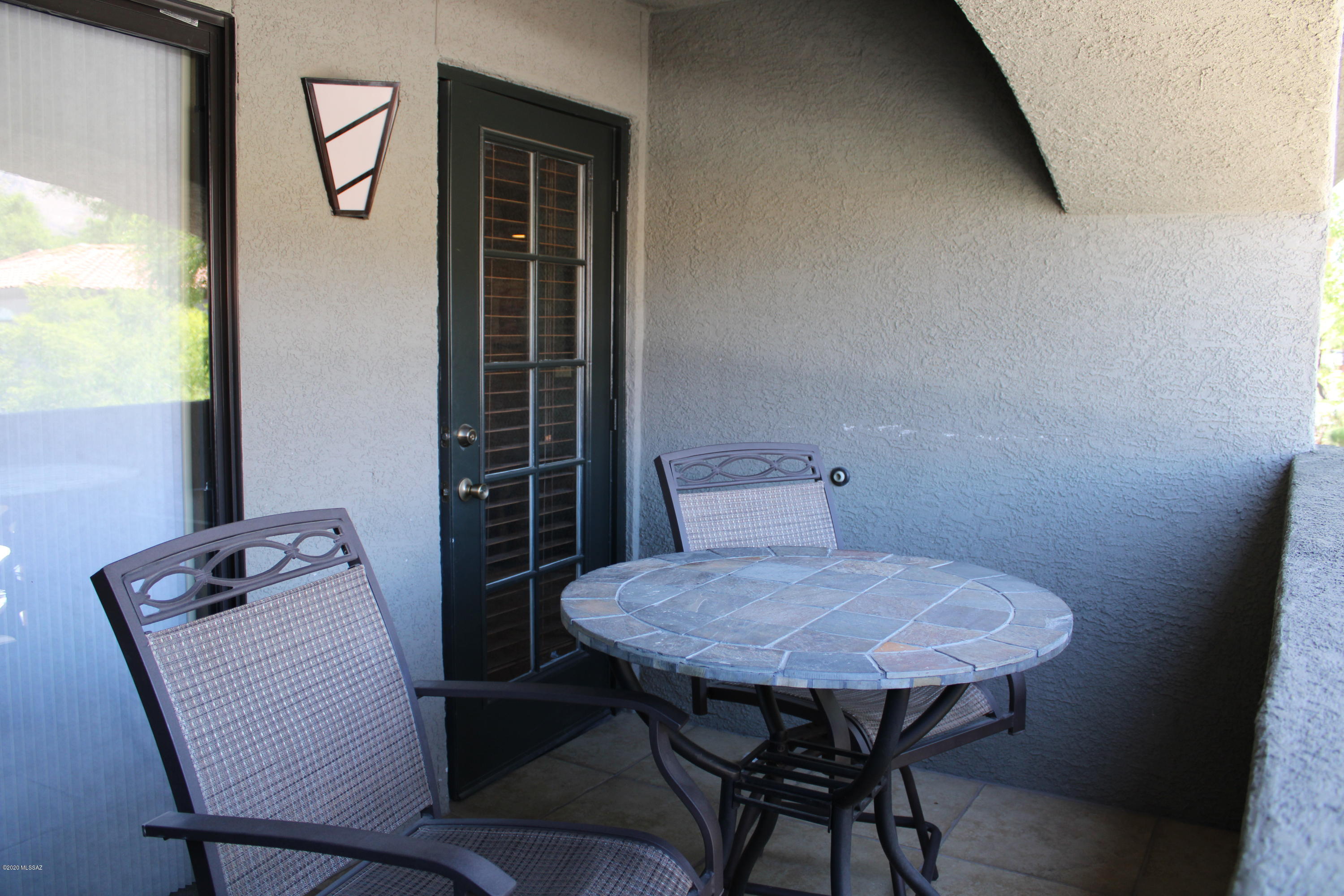 5751 North Kolb Road, Unit 36203 Tucson, AZ 85750 - Photo 22 of 25 a view of a room that has a table and chair