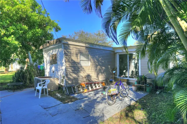 a backyard of a house with seating space