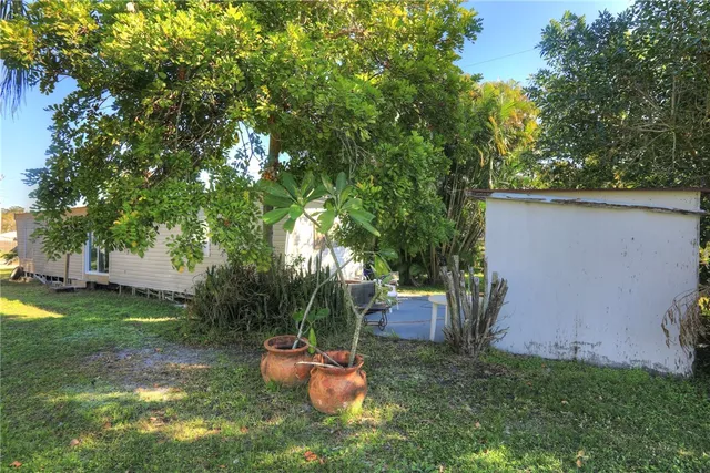 a view of a room with furniture and wooden floor