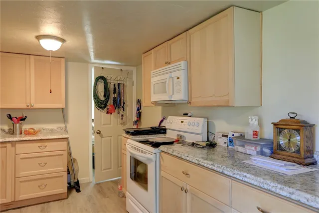 a view of a balcony with chairs and a table