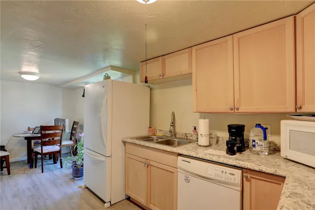 a bedroom with bed and a window