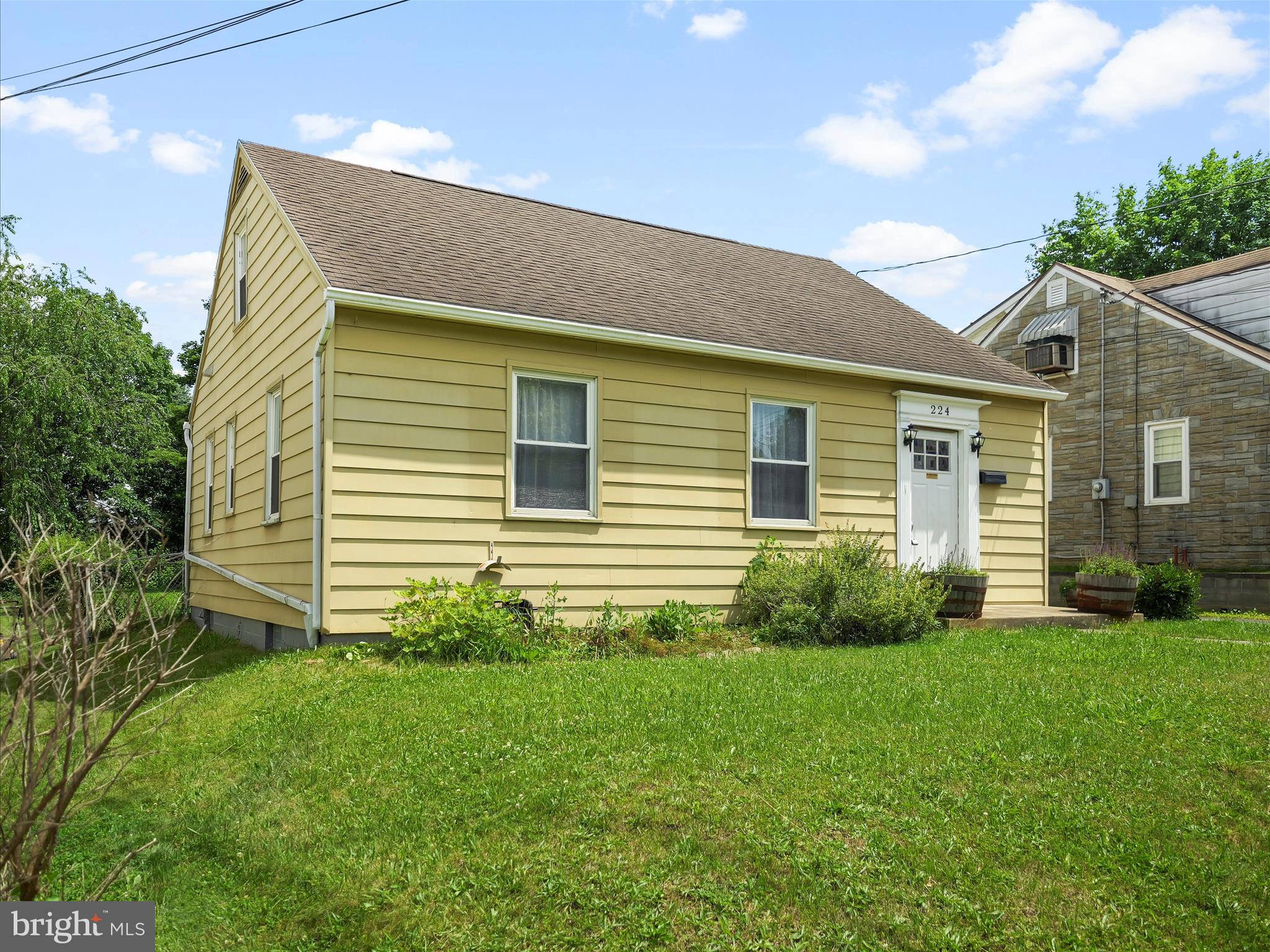 224 Devonshire Road Hagerstown, MD 21740 - Photo 5 of 28 a view of a house with a yard and plants