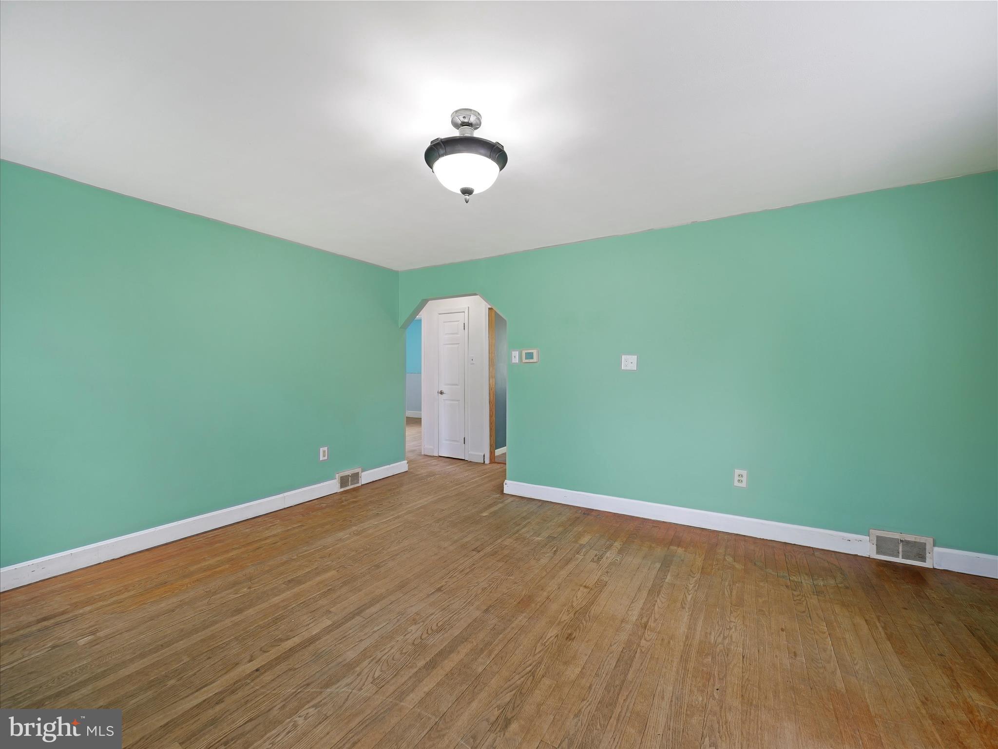 224 Devonshire Road Hagerstown, MD 21740 - Photo 6 of 28 a view of a room with wooden floor and fan
