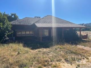 11727 Elk Mountain Road Upper Lake, CA 95485 - Photo 1 of 60 a front view of a house with a yard