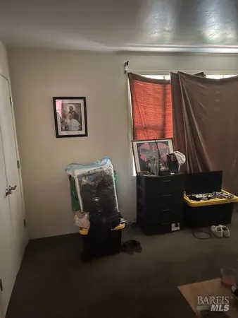 a view of a dry yard with a tree