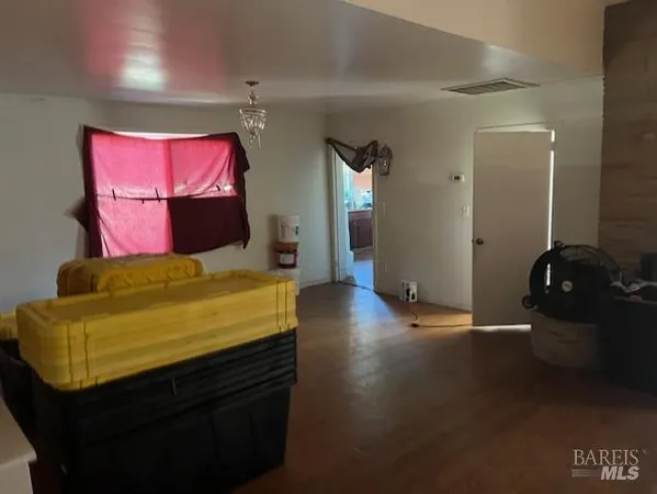 a backyard of a house with plants and outdoor seating