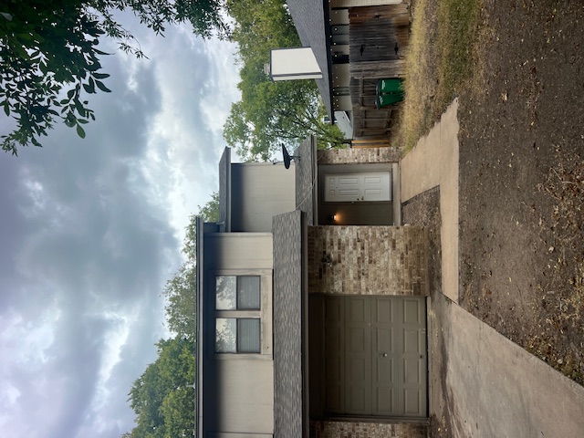 11429 Ptarmigan Drive, Unit B Austin, TX 78758 - Photo 1 of 27 a front view of a house with a yard