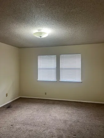 an empty room with a empty space and window