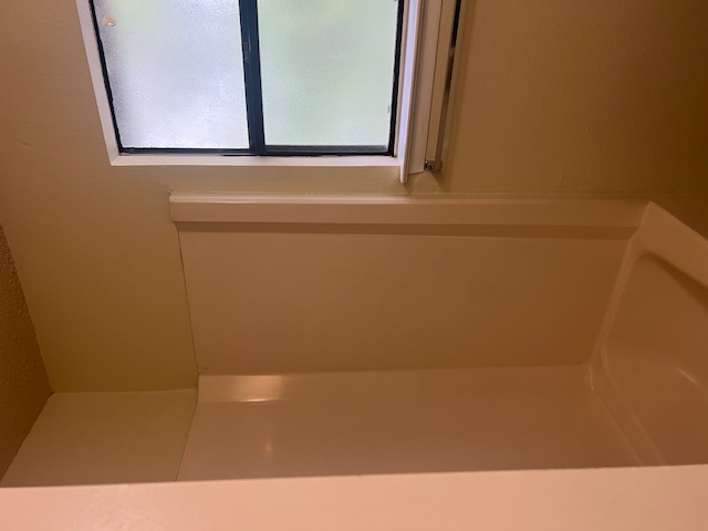 11429 Ptarmigan Drive, Unit B Austin, TX 78758 - Photo 17 of 27 a bathroom with a shower