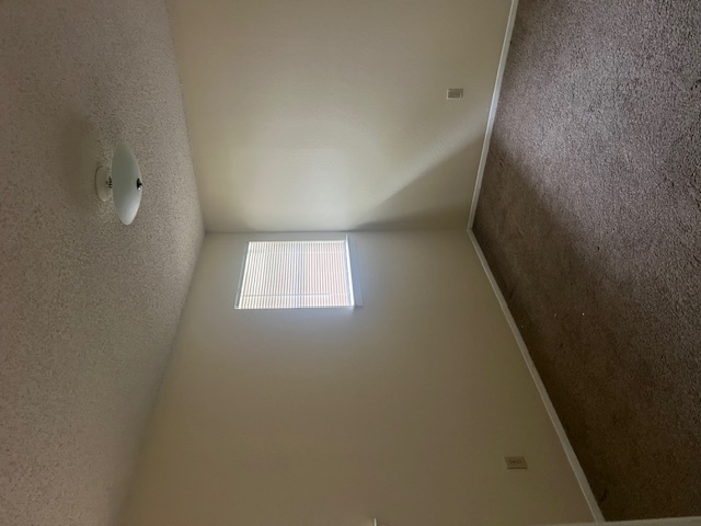 11429 Ptarmigan Drive, Unit B Austin, TX 78758 - Photo 18 of 27 an empty room with a window