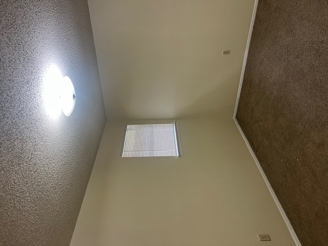 11429 Ptarmigan Drive, Unit B Austin, TX 78758 - Photo 20 of 27 an empty room with a empty space and windows