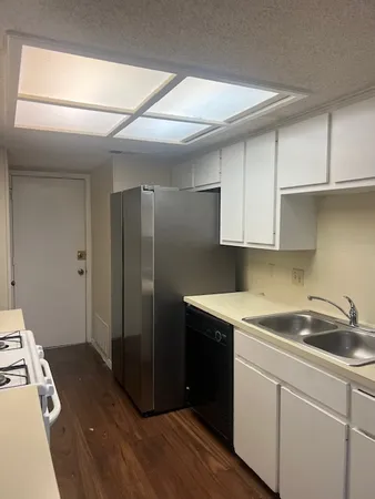 a kitchen with a sink and cabinets