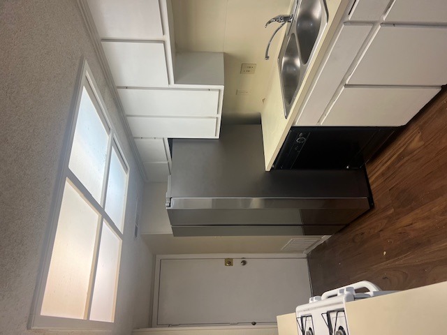 11429 Ptarmigan Drive, Unit B Austin, TX 78758 - Photo 4 of 27 a kitchen with a sink and cabinets