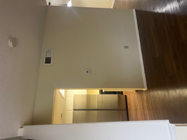 11429 Ptarmigan Drive, Unit B Austin, TX 78758 - Photo 9 of 27 wooden floor in an empty room