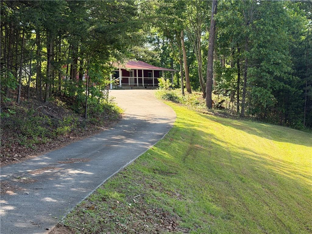 86 Robert Jones Road Dawsonville, GA 30534 - Photo 3 of 19 a view of a swimming pool with a patio