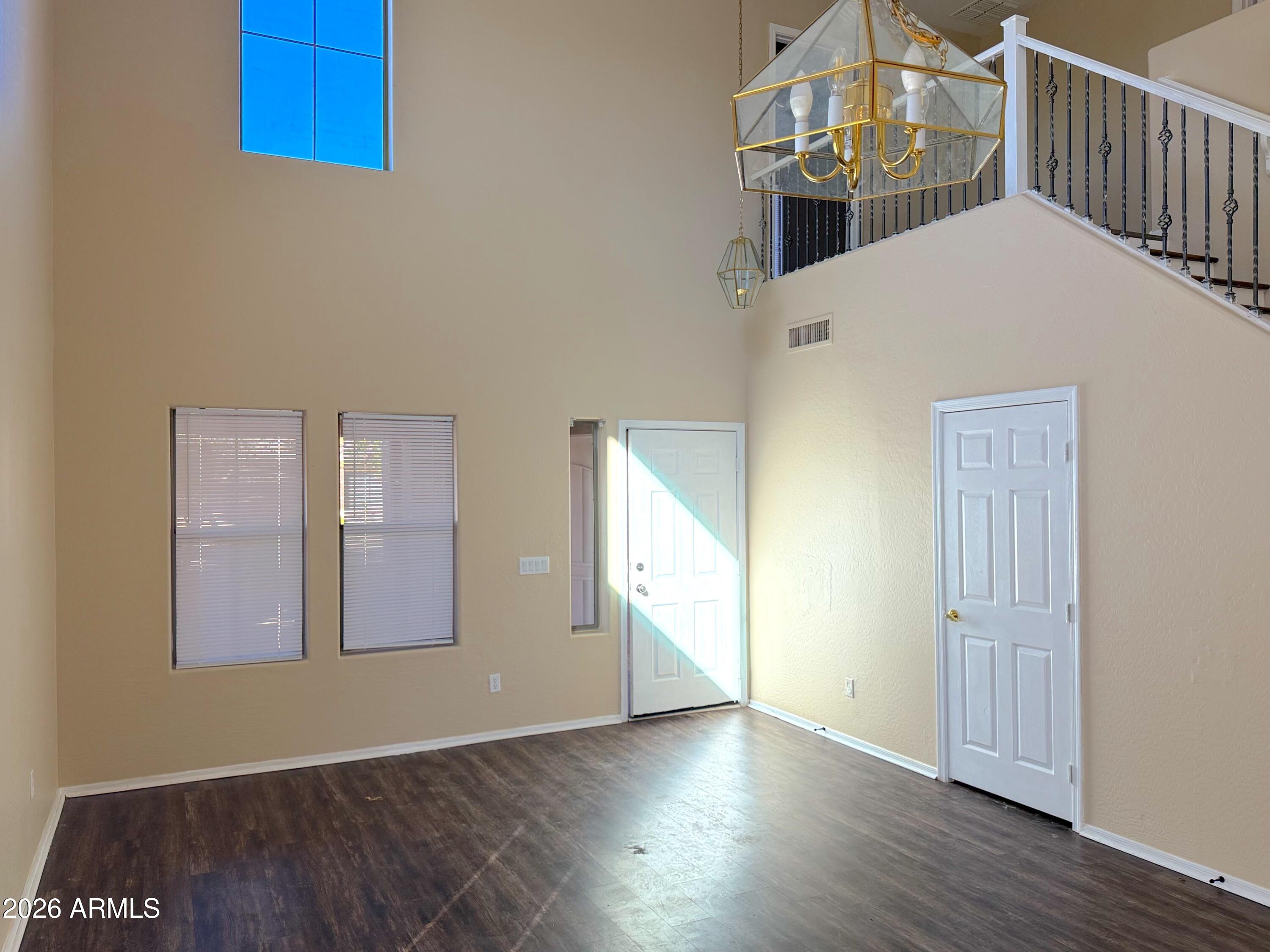 3545 East Crescent Way Gilbert, AZ 85298 - Photo 4 of 19 a view of entryway and hall with wooden floor