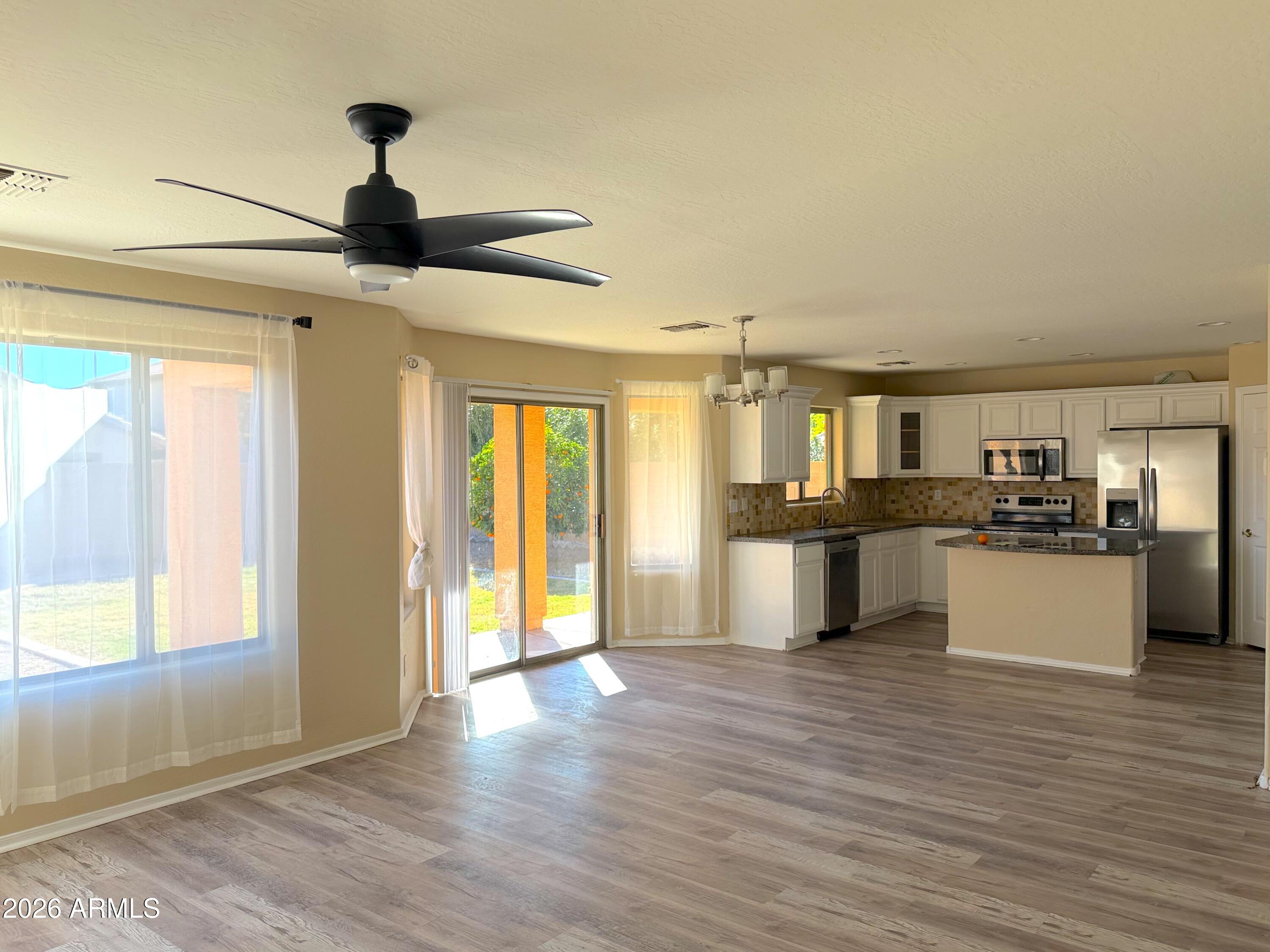 3545 East Crescent Way Gilbert, AZ 85298 - Photo 6 of 19 a view of kitchen with sink and wooden floor
