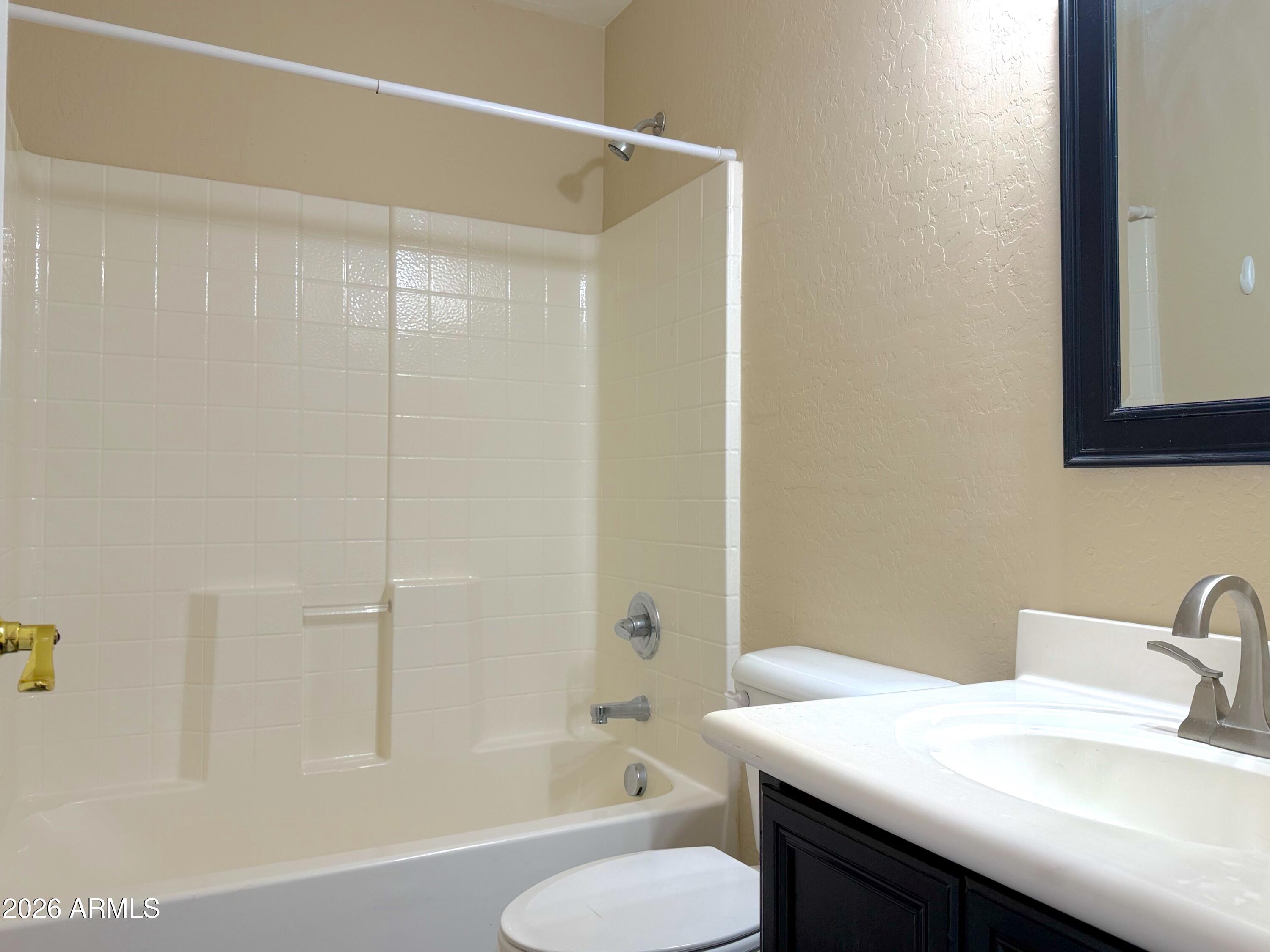 3545 East Crescent Way Gilbert, AZ 85298 - Photo 8 of 19 a bathroom with a sink toilet and shower