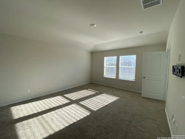 a view of an empty room and window