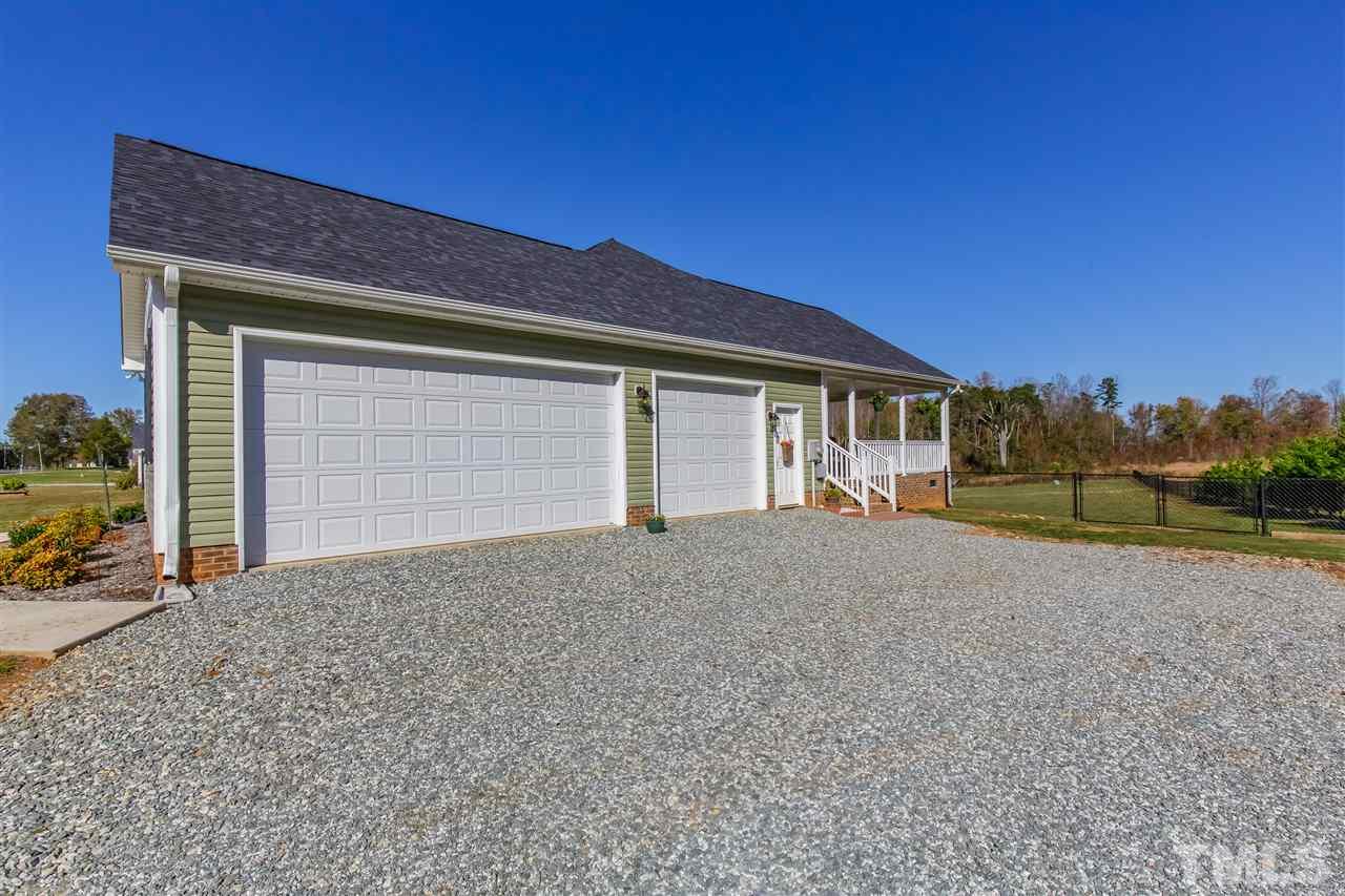 3 car garage measuring 29.8' x 23.4' with additional alcove of 13.5' x 5.8'