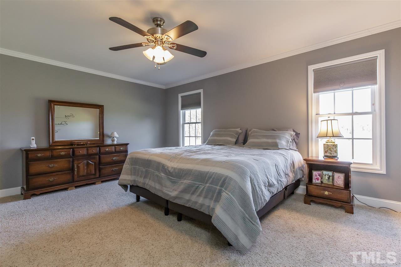 319 Boone Road Burlington, NC 27217 - Photo 14 of 30 Master suite located on rear of the home with carpet, fan and crown