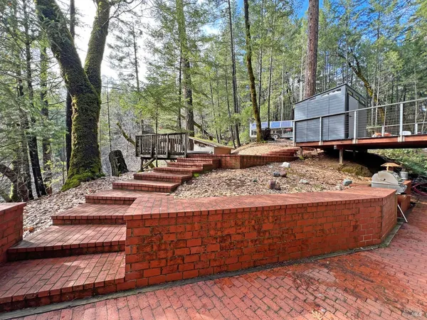 a view of a backyard with a sitting area