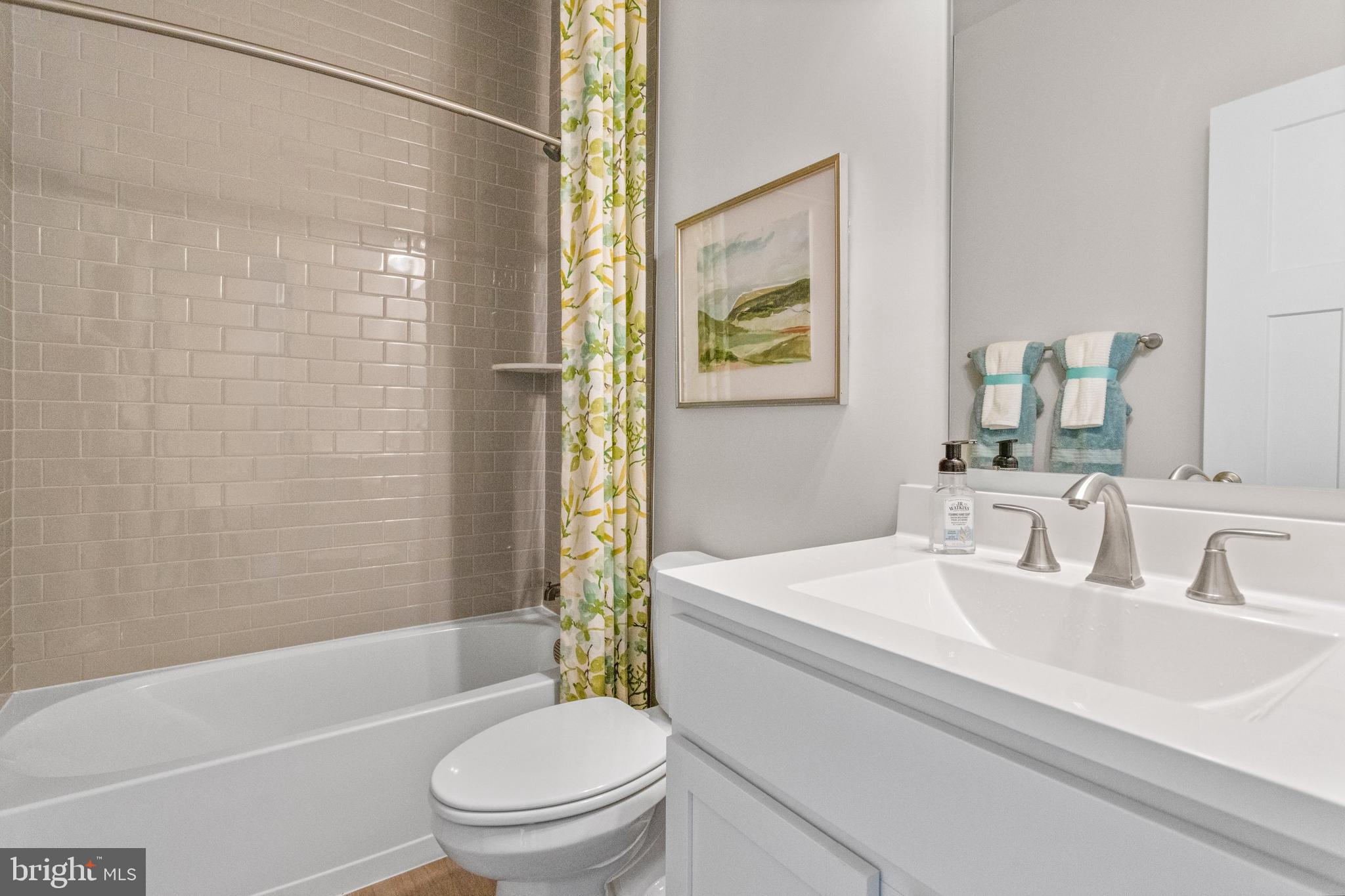206 Williamson Road Winchester, VA 22602 - Photo 18 of 22 a bathroom with a sink toilet and shower