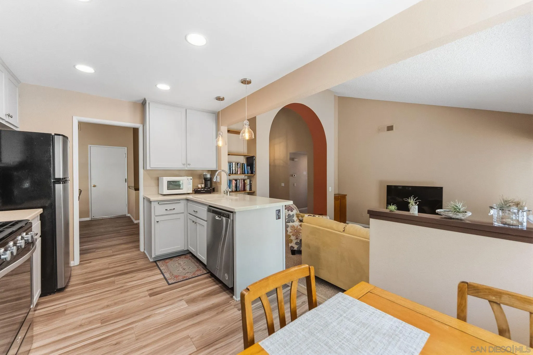 10565 Strathmore Drive Santee, CA 92071 - Photo 19 of 59 a kitchen with a sink appliances and wooden floor