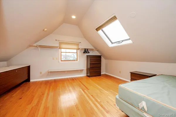 a view of a room with wooden floor and chair