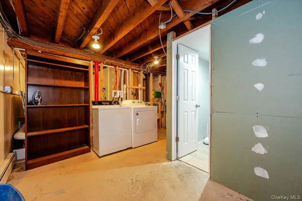 a room with wooden floor and stairs