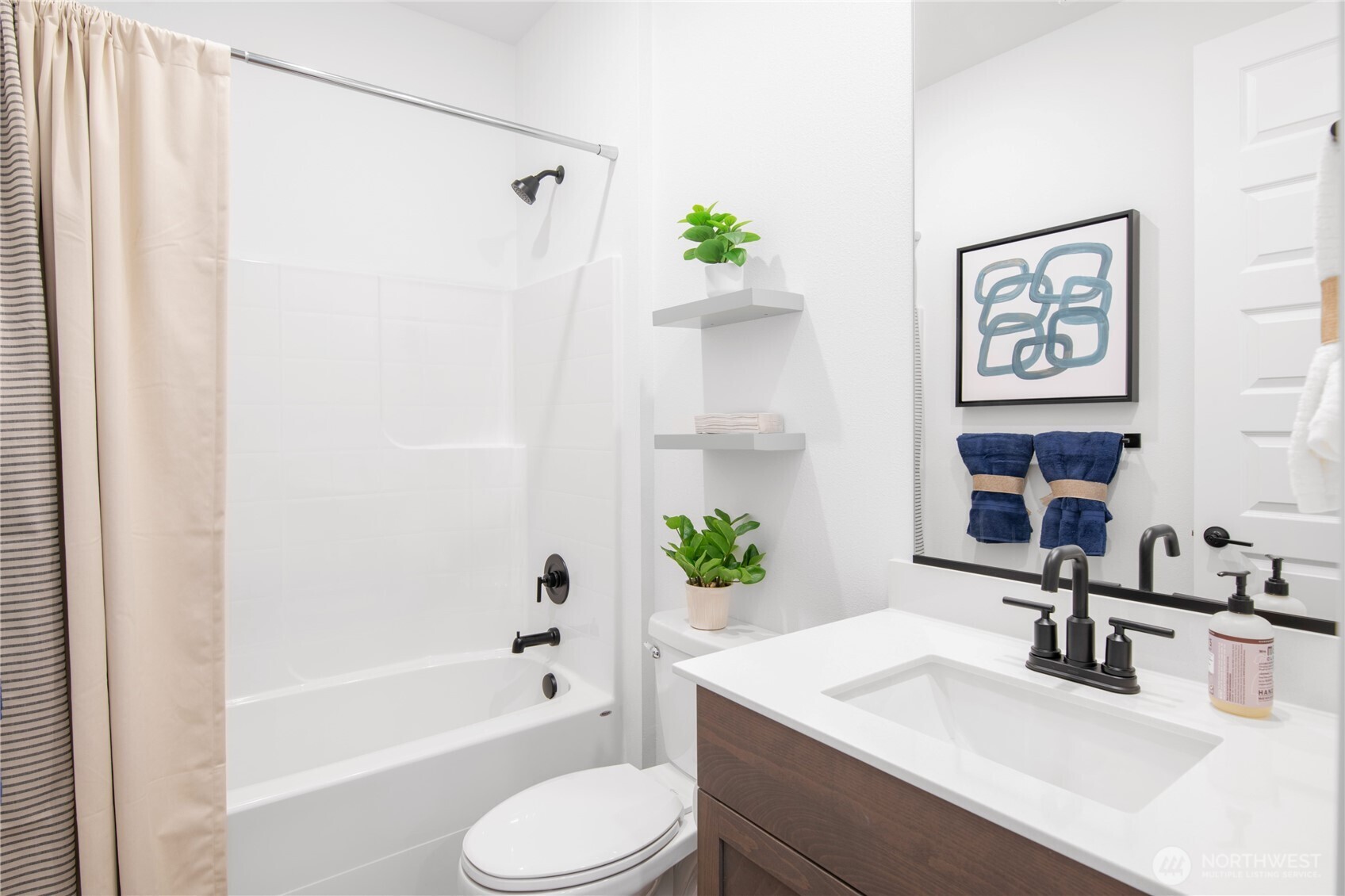 571 Silver Frost Drive Sequim, WA 98382 - Photo 10 of 12 a bathroom with a sink toilet and bathtub