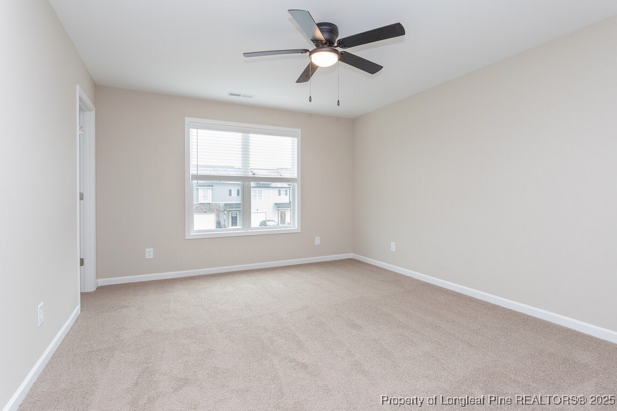 905 Kingscote Drive Fayetteville, NC 28314 - Photo 14 of 30 an empty room with a window and a fan