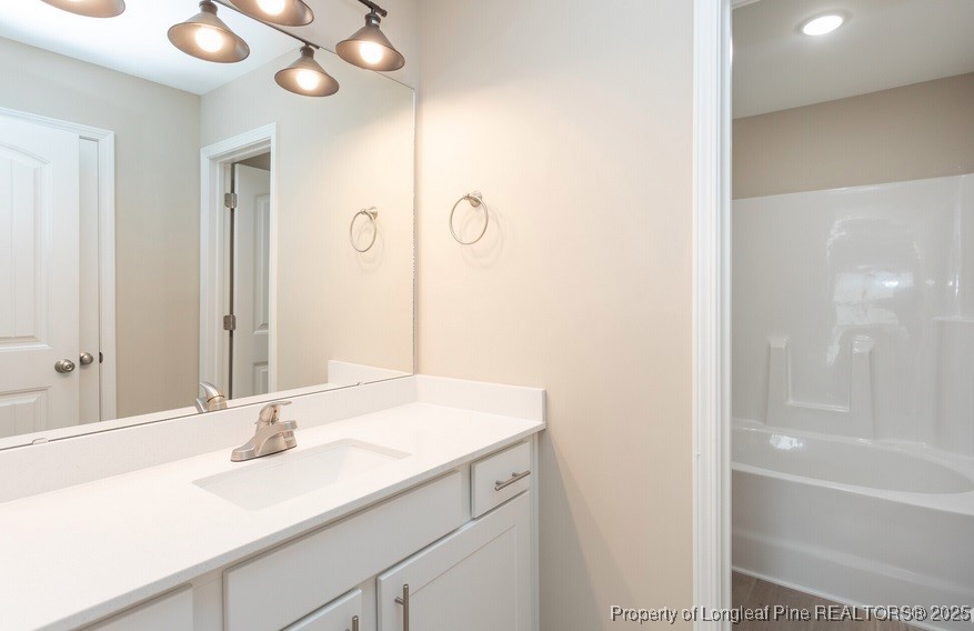 905 Kingscote Drive Fayetteville, NC 28314 - Photo 17 of 30 a bathroom with a sink and a mirror