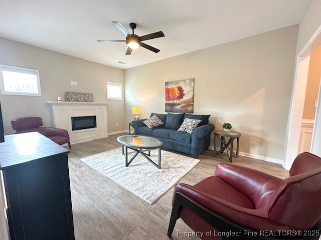 905 Kingscote Drive Fayetteville, NC 28314 - Photo 6 of 30 a living room with furniture a fireplace and a window
