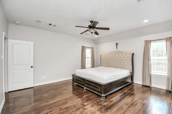 a bedroom with a bed and window