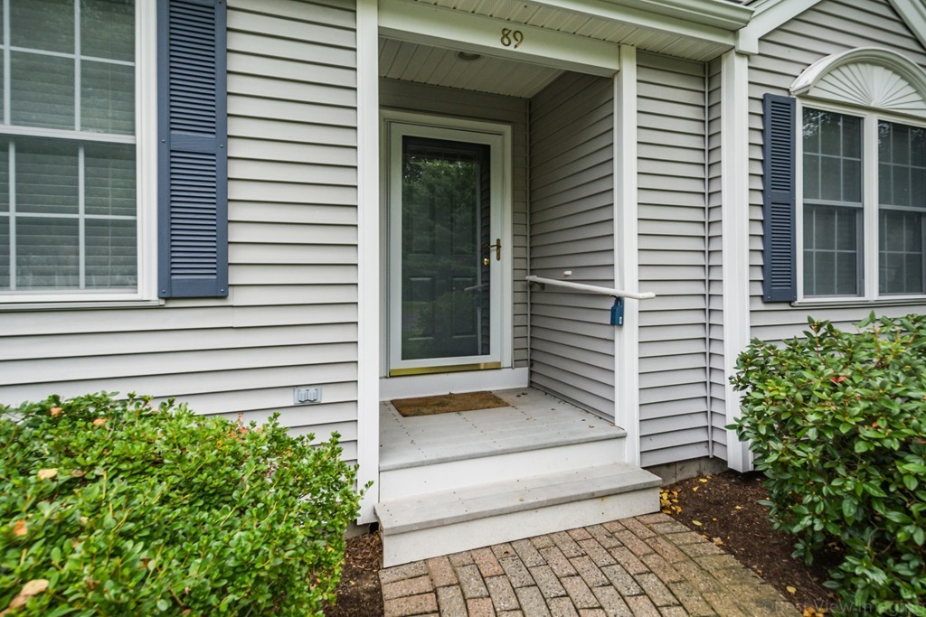 89 Stow Road, Unit 1 Boxborough, MA 01719 - Photo 3 of 25 a view of a house with a window