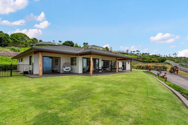 a spacious bedroom with a bed and a large window