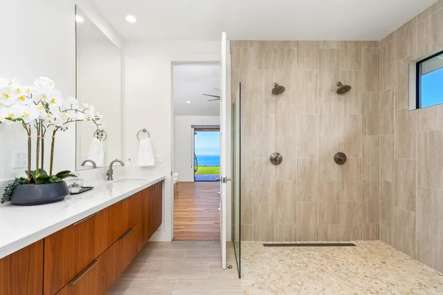 a bathroom with a tub and a shower