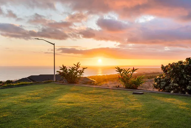 a view of a lake with a yard