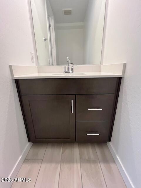 3341 South Lotus Mesa, AZ 85212 - Photo 14 of 42 a bathroom with a sink and a mirror