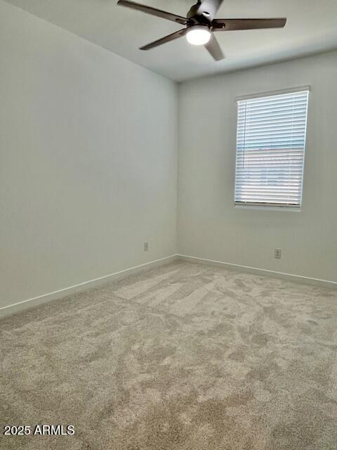 3341 South Lotus Mesa, AZ 85212 - Photo 16 of 42 an empty room with a ceiling fan and window