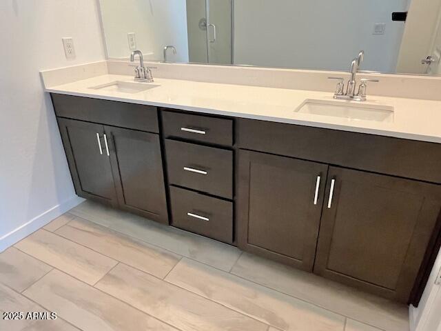 3341 South Lotus Mesa, AZ 85212 - Photo 30 of 42 a bathroom with a sink and a mirror