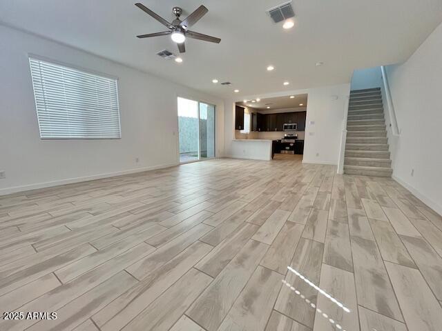 3341 South Lotus Mesa, AZ 85212 - Photo 6 of 42 a view of empty room with wooden floor and fan