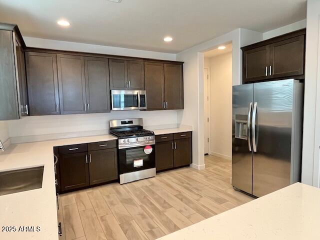 3341 South Lotus Mesa, AZ 85212 - Photo 8 of 42 a kitchen with granite countertop stainless steel appliances and wooden cabinets