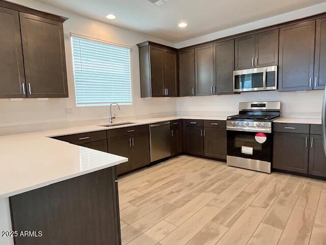 3341 South Lotus Mesa, AZ 85212 - Photo 9 of 42 a kitchen with stainless steel appliances granite countertop a sink counter space cabinets and a sink
