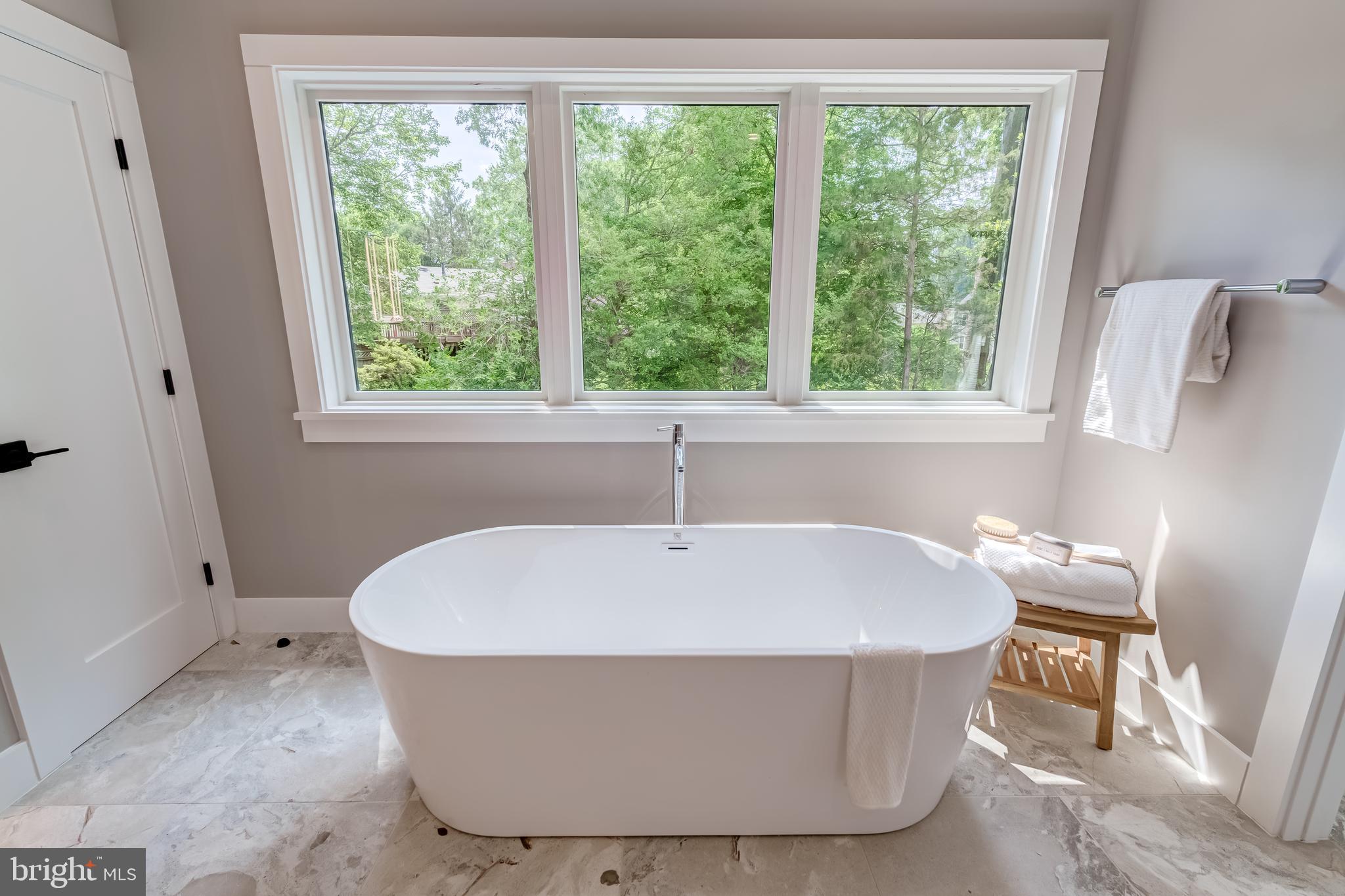506 Kingsley Road Southwest Vienna, VA 22180 - Photo 81 of 150 a white bath tub sitting in a bathroom next to a window